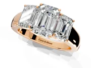 3 Stone Engagement Ring Setting for Emerald Cut Center with Raised Basket Heads and Prong Head in Rose Gold
