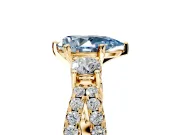3 Stone Engagement Ring Setting for Fancy Blue Pear-Shaped Center with Pave Split Shank and Prong Head in Yellow Gold