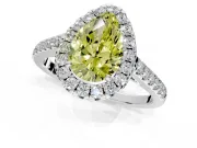 Halo Engagement Ring Setting for Fancy Yellow Pear-Shaped Center with Narrowing Pave Band and Prong Head in White Gold