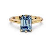 Solitaire Engagement Ring Setting for Fancy Blue Emerald Cut Center with Cathedral Band and Prong Head in Yellow Gold