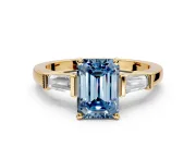 3 Stone Engagement Ring Setting for Fancy Blue Emerald Cut Center with Channel Baguette Accents and Prong Head in Yellow Gold