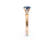 3 Stone Engagement Ring Setting for Fancy Blue Round Cut Center with Wide Plain Band and Prong Head in Rose Gold