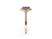 Halo Engagement Ring Setting for Fancy Blue Emerald Cut Center with Raised Halo, Pave Band and Prong Head in Rose Gold