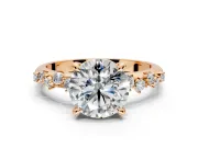 Solitaire Engagement Ring Setting for Round Cut Center with Trailing Leaf Accent Band and Prong Head in Rose Gold