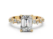 Solitaire Engagement Ring Setting for Emerald Cut Center with Trailing Leaf Accent Band and Prong Head in Yellow Gold