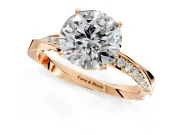 Side Accent Engagement Ring Setting for Round Cut Center with Accent Shoulders and Prong Head in Rose Gold