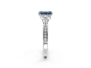 Cluster Engagement Ring Setting for Fancy Blue Emerald Cut Center with Bezel Accent Clusters and Prong Head in White Gold