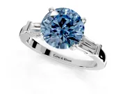 3 Stone Engagement Ring Setting for Fancy Blue Round Cut Center with Channel Baguette Accents and Prong Head in Sterling Silver