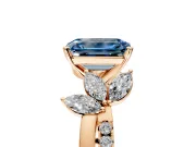 Floral Engagement Ring Setting for Fancy Blue Emerald Cut Center with Trailing Marquise Accents and Prong Head in Rose Gold