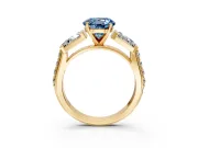 Channel-Set Engagement Ring Setting for Fancy Blue Round Cut Center with Baguette Band and Prong Head in Yellow Gold
