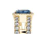 Halo Engagement Ring Setting for Fancy Blue Emerald Cut Center with Wide-Open Pave Split Shank and Prong Head in Yellow Gold