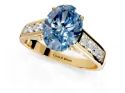 Solitaire Engagement Ring Setting for Fancy Blue Oval Center with Cathedral Channel Band and Prong Head in Yellow Gold