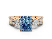 3 Stone Engagement Ring Setting for Fancy Blue Radiant Cut Center with Pave Split Shank and Prong Head in Rose Gold