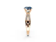 3 Stone Engagement Ring Setting for Fancy Blue Round Cut Center with Pave Split Shank and Prong Head in Rose Gold