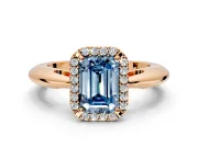 Halo Engagement Ring Setting for Fancy Blue Emerald Cut Center with Tapered Plain Band and Prong Head in Rose Gold