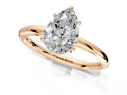 Low-Set Solitaire Engagement Ring Setting for Pear-Shaped Center with Thin Plain Band and Prong Head in Rose Gold