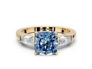 3 Stone Engagement Ring Setting for Fancy Blue Cushion Cut Center with Tapered Baguettes, Plain Band and Prong Head in Yellow Gold