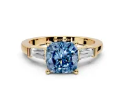 3 Stone Engagement Ring Setting for Fancy Blue Cushion Cut Center with Channel Baguette Accents and Prong Head in Yellow Gold