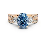3 Stone Engagement Ring Setting for Fancy Blue Oval Center with Pave Twist Band and Prong Head in Rose Gold