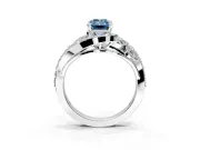 Halo Engagement Ring Setting for Fancy Blue Emerald Cut Center with Marquise and Pave Bypass Band and Prong Head in White Gold