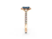 Halo Engagement Ring Setting for Fancy Blue Emerald Cut Center with Full Pave Band and Prong Head in Rose Gold
