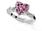 3 Stone Engagement Ring Setting for Fancy Pink Heart-Shaped Center with Channel Baguette Accents and Prong Head in Platinum