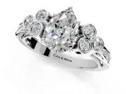 Cluster Engagement Ring Setting for Pear-Shaped Center with Bezel Accent Clusters and Prong Head in White Gold