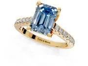 Solitaire Engagement Ring Setting for Fancy Blue Emerald Cut Center with Widening Pave Band and Claw Prong Head in Yellow Gold