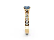 Solitaire Engagement Ring Setting for Fancy Blue Cushion Cut Center with Channel-Set Accents and Prong Head in Yellow Gold