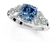 Cluster Engagement Ring Setting for Fancy Blue Cushion Cut Center with Round Cut Accent Frame and Prong Head in Platinum