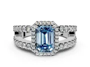 Halo Engagement Ring Setting for Fancy Blue Emerald Cut Center with Wide-Open Pave Split Shank and Prong Head in Platinum