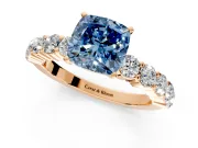 Shared-Prong Engagement Ring Setting for Fancy Blue Cushion Cut Center with Graduated Accents and Prong Head in Rose Gold