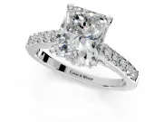 Solitaire Engagement Ring Setting for Radiant Cut Center with Crossover Accents and Prong Head in Platinum