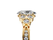 Cluster Engagement Ring Setting for Oval Center with Bezel Accent Clusters and Prong Head in Yellow Gold