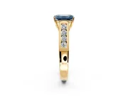 Solitaire Engagement Ring Setting for Fancy Blue Emerald Cut Center with Cathedral Channel Band and Prong Head in Yellow Gold