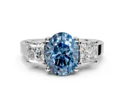 3 Stone Engagement Ring Setting for Fancy Blue Oval Center with Matching Side Accents and Prong Head in Platinum