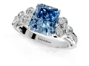 Cluster Engagement Ring Setting for Fancy Blue Radiant Cut Center with Bezel Accent Clusters and Prong Head in Platinum