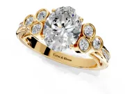 Cluster Engagement Ring Setting for Oval Center with Bezel Accent Clusters and Prong Head in Yellow Gold