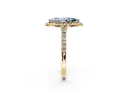 Halo Engagement Ring Setting for Fancy Blue Marquise Center with Narrowing Pave Band and Prong Head in Yellow Gold