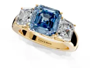 3 Stone Engagement Ring Setting for Fancy Blue Asscher Cut Center with Raised Basket Heads and Prong Head in Yellow Gold