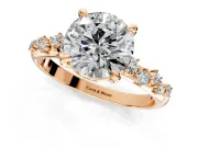 Solitaire Engagement Ring Setting for Round Cut Center with Trailing Leaf Accent Band and Prong Head in Rose Gold