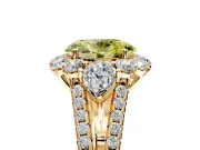 Halo Engagement Ring Setting for Fancy Yellow Oval Center with Two-Strand Split Shank and Prong Head in Yellow Gold