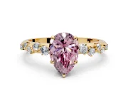 Cluster Engagement Ring Setting for Fancy Pink Pear-Shaped Center with Round Cut Accent Band and Prong Head in Yellow Gold