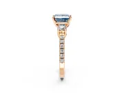3 Stone Engagement Ring Setting for Fancy Blue Princess Cut Center with Round Cut Side Accents and Prong Head in Rose Gold