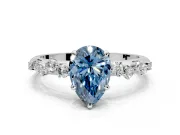 Cluster Engagement Ring Setting for Fancy Blue Pear-Shaped Center with Round Cut Accent Band and Prong Head in Platinum