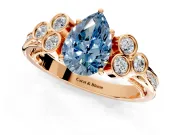 Cluster Engagement Ring Setting for Fancy Blue Pear-Shaped Center with Bezel Accent Clusters and Prong Head in Rose Gold