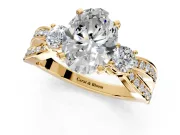 3 Stone Engagement Ring Setting for Oval Center with Pave Twist Band and Prong Head in Yellow Gold