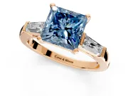 3 Stone Engagement Ring Setting for Fancy Blue Princess Cut Center with Tapered Baguettes, Plain Band and Prong Head in Rose Gold