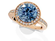 Halo Engagement Ring Setting for Fancy Blue Round Cut Center with Metal-Rimmed Halo, Pave Band and Prong Head in Rose Gold