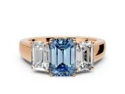 3 Stone Engagement Ring Setting for Fancy Blue Emerald Cut Center with Raised Basket Heads and Prong Head in Rose Gold